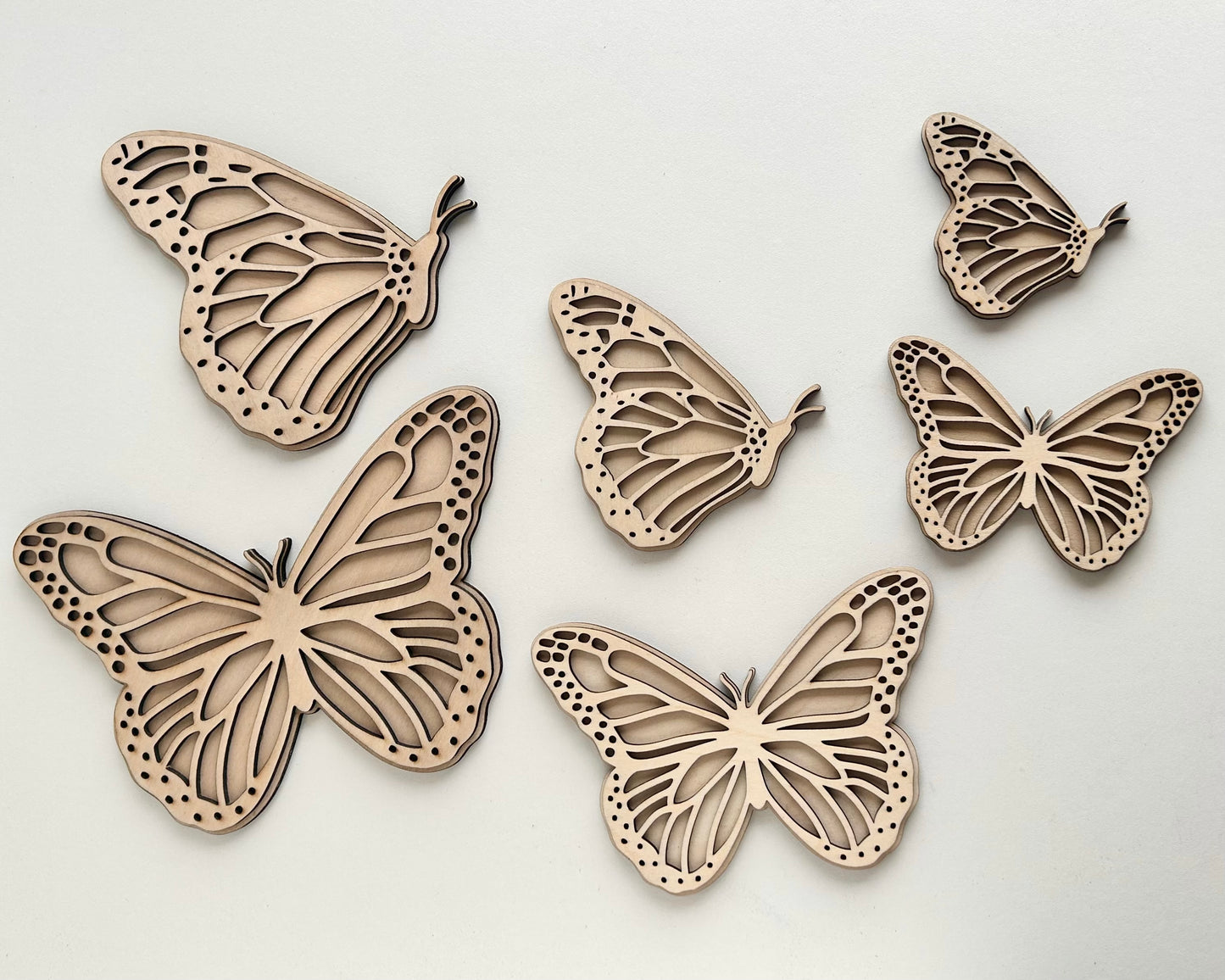 Set of 2 Butterfly wall art, one with open wings and one closed. Perfect for a girls bedroom, playroom or nursery. This kids decor is made from laser cut wood and double layered. Available in three sizes, Mini, standard and large