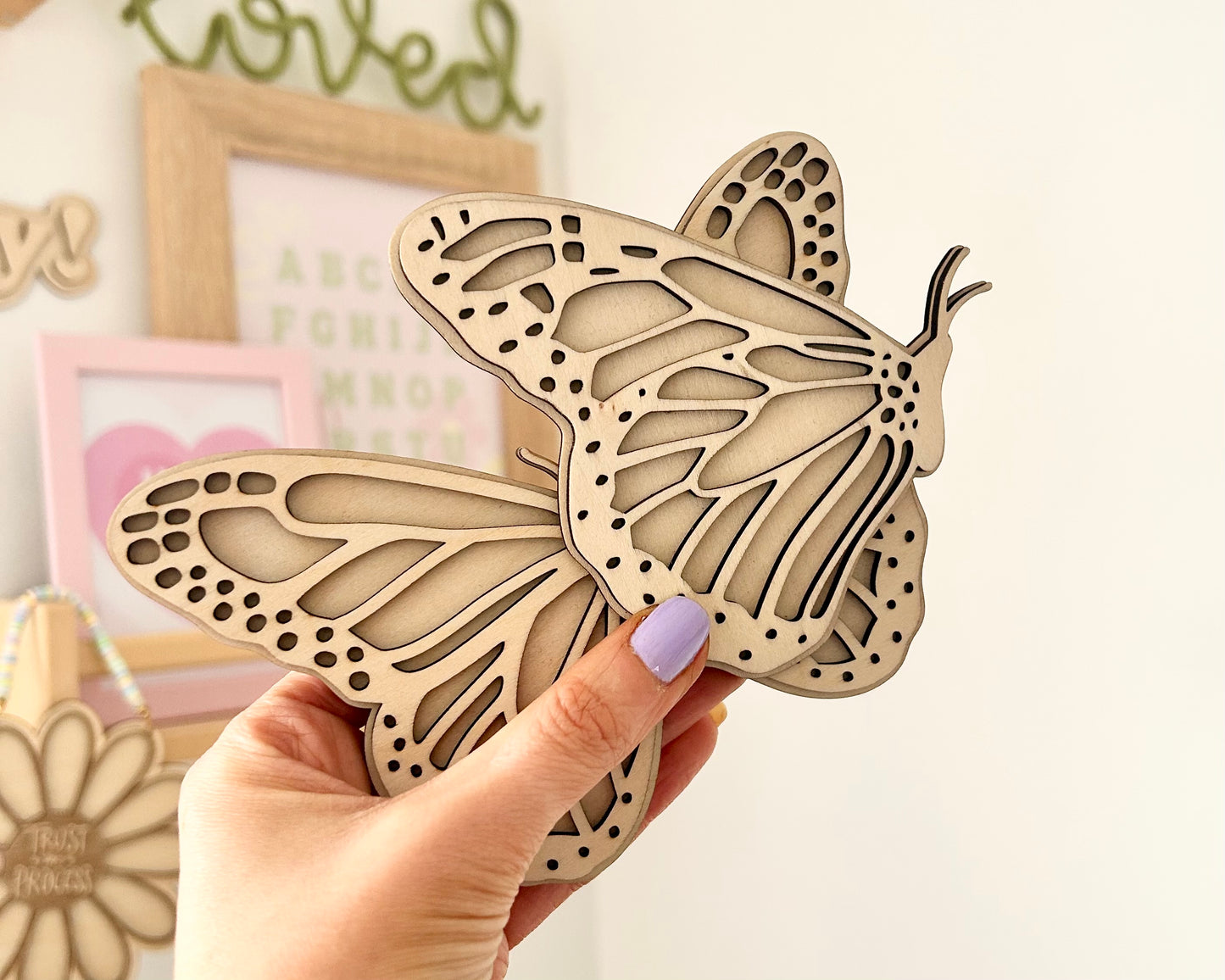 Set of 2 Butterfly wall art, one with open wings and one closed. Perfect for a girls bedroom, playroom or nursery. This kids decor is made from laser cut wood and double layered. In size standard
