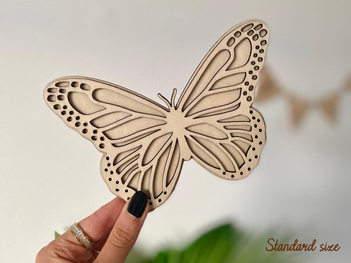 Set of 2 Butterfly wall art, one with open wings and one closed. Perfect for a girls bedroom, playroom or nursery. This kids decor is made from laser cut wood and double layered.