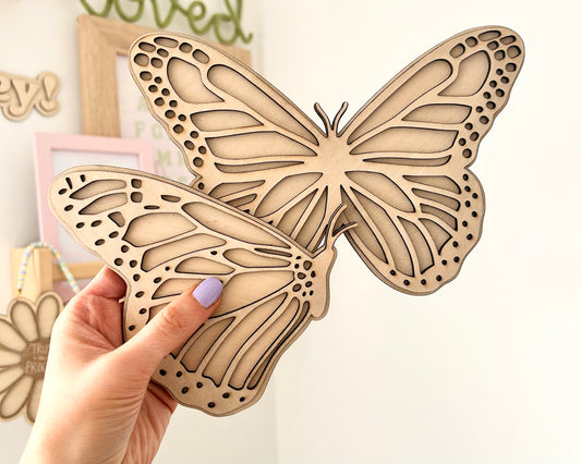 Set of 2 Butterfly wall art, one with open wings and one closed. Perfect for a girls bedroom, playroom or nursery. This kids decor is made from laser cut wood and double layered. In size large 